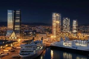 Port de nuit avec gratte-ciels illuminés.